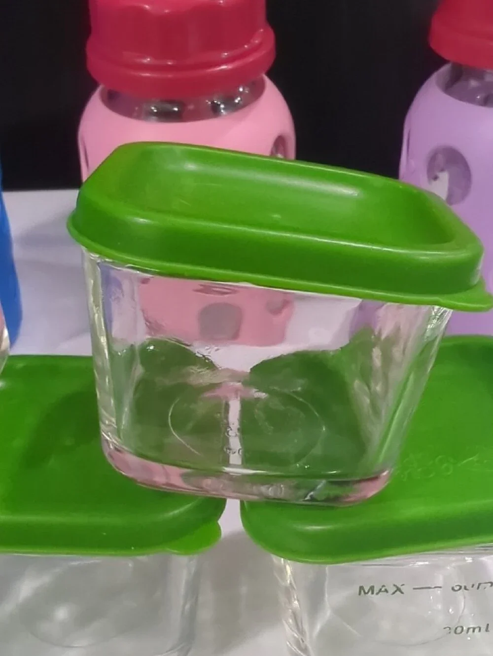 Glass Food Storage Set with Green Lids and Assorted Silicone Bottles